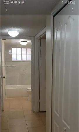 a spacious en suite bathroom with a toilet and a shower