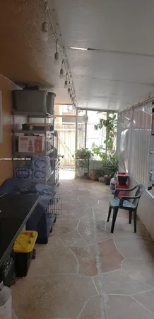 a living room with furniture and a outdoor space