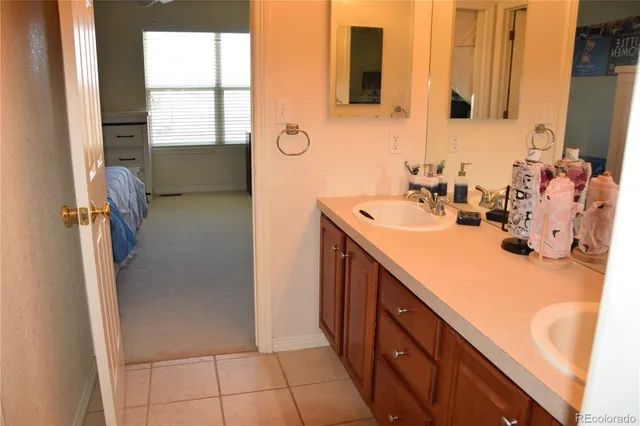 a bathroom with a sink a mirror and a shower