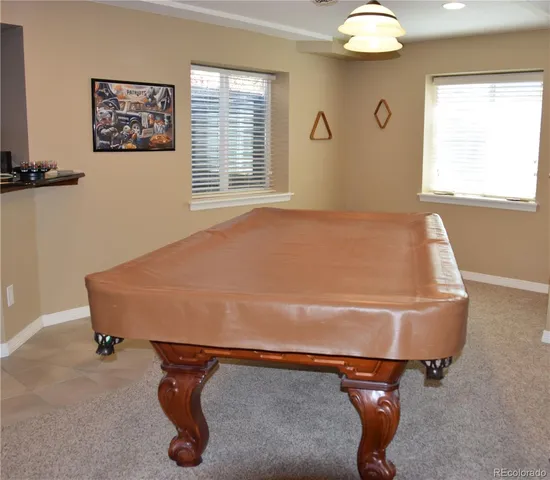 a bed sitting in a room next to a window