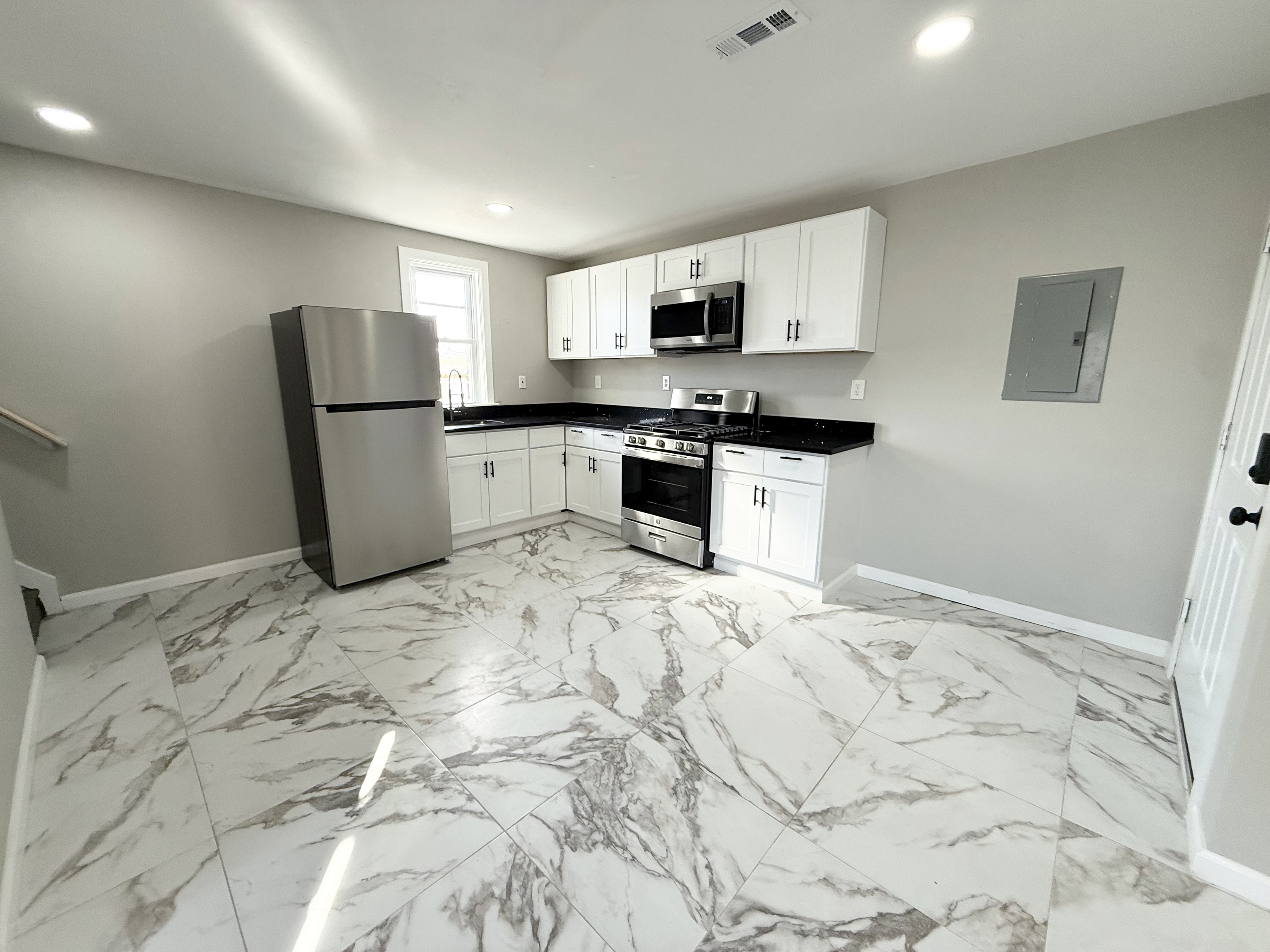 41 Howe Street, Unit 2 New Haven, CT 06511 - Photo 2 of 9 a kitchen with stainless steel appliances granite countertop a refrigerator sink and stove