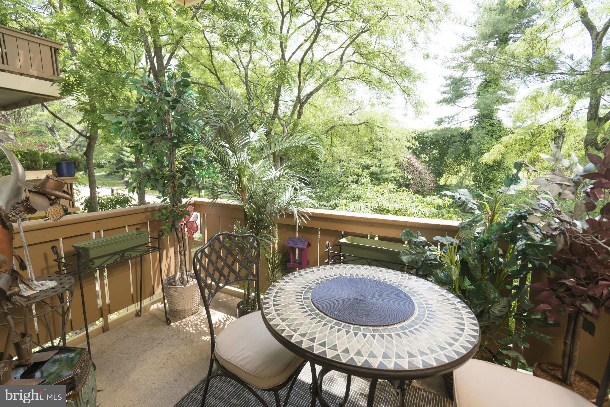 5 Hamill Road, Unit 5C Baltimore, MD 21210 - Photo 22 of 24 a patio with table and chairs