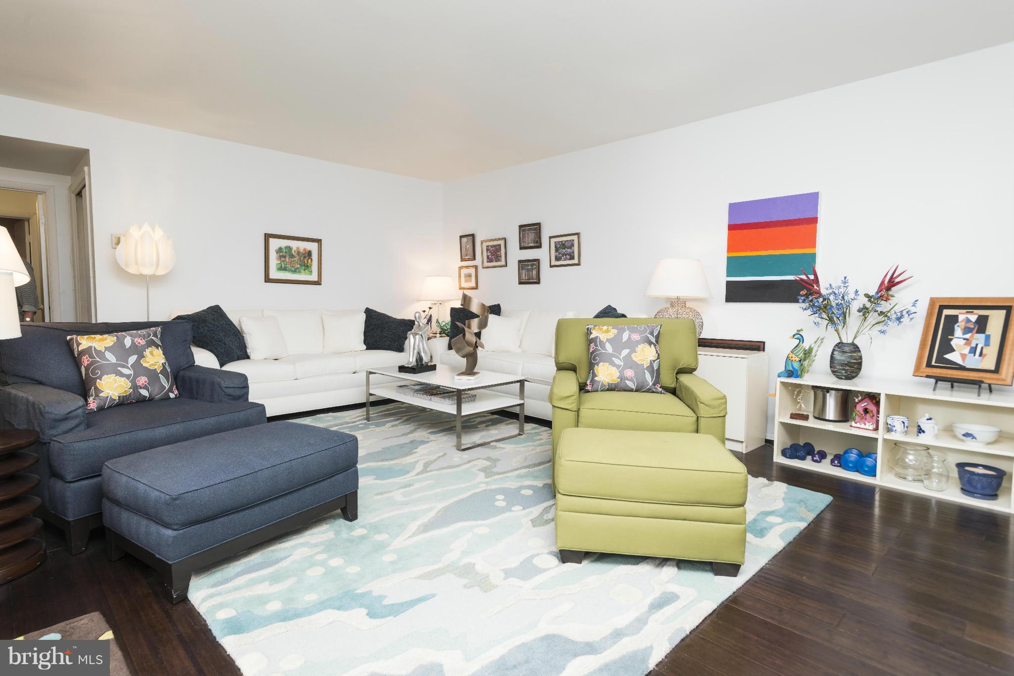 5 Hamill Road, Unit 5C Baltimore, MD 21210 - Photo 7 of 24 a living room with furniture and a wooden floor