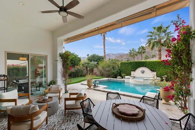 a view of a patio with a table chairs and a table