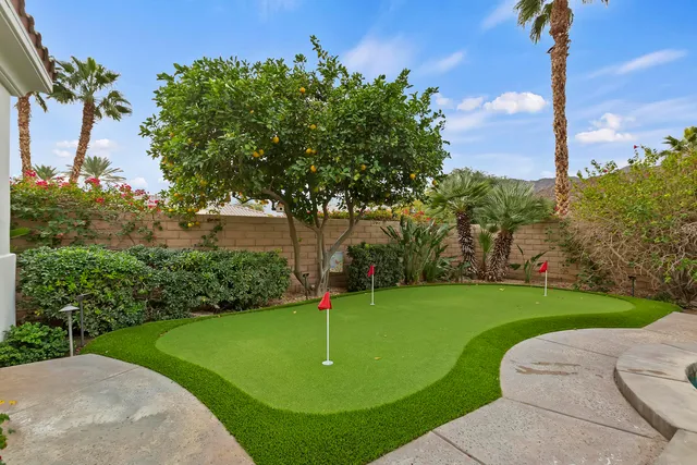a view of a garden with a fountain