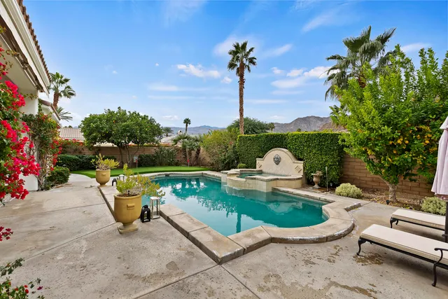 a view of a swimming pool with a patio