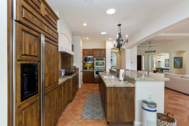 a large kitchen with granite countertop lots of counter top space
