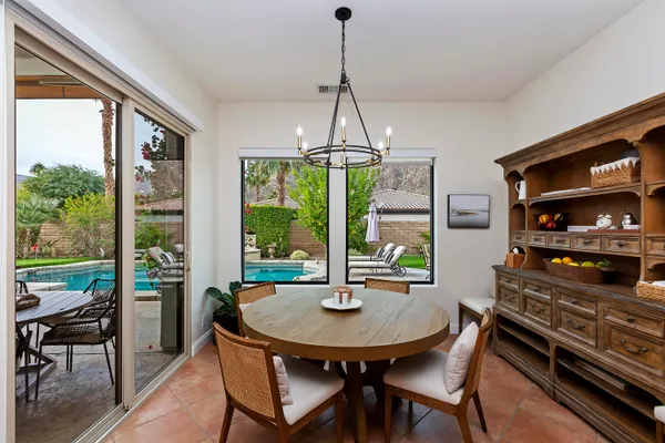 a view of a dining room with furniture window and outside view
