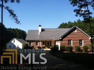 2899 Teamon Road Griffin, GA 30223 - Photo 1 of 1 a front view of a house with garden