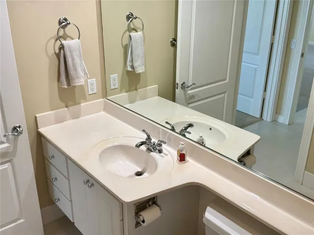 a bathroom with a sink and a mirror