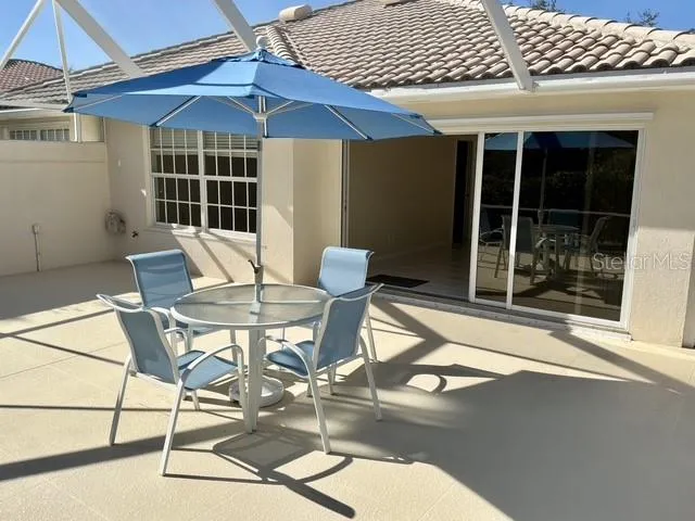 a view of a chair and table in the balcony