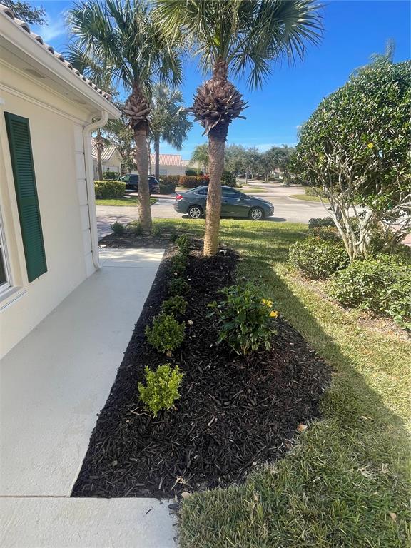 5651 Modena Place Sarasota, FL 34238 - Photo 2 of 33 a view of a yard with plants
