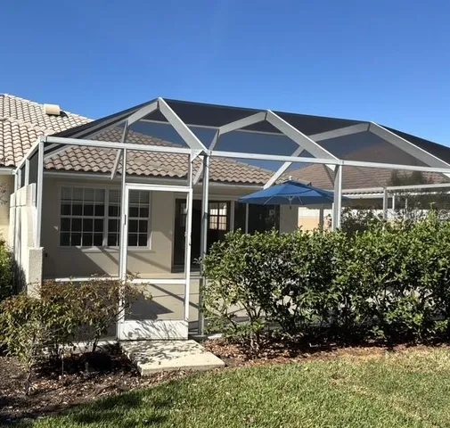 a view of a tree in the middle of a yard