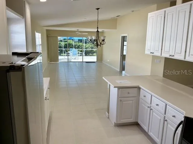 a kitchen with appliances cabinets and a sink
