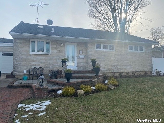 25 Roxbury Avenue Plainview, NY 11803 - Photo 1 of 1 a front view of a house with a yard