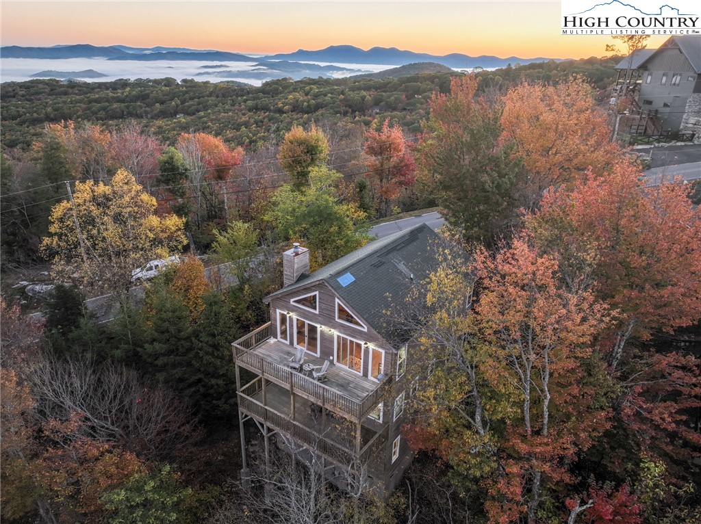 309 Pinnacle Ridge Road Beech Mountain, NC 28604 - Photo 42 of 45 a view of a house with a mountain and a forest
