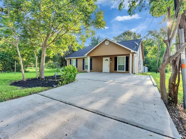 front view of a house with a yard
