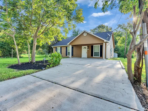 front view of a house with a yard