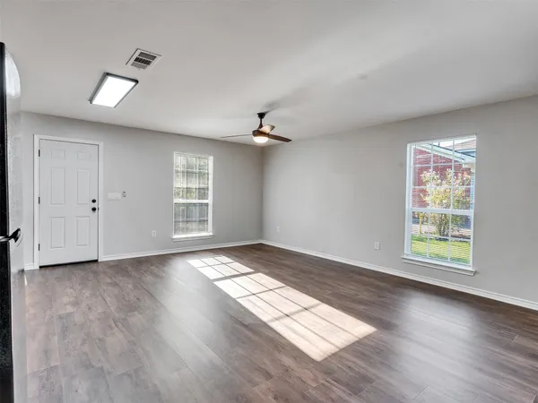 a view of an empty room with a window