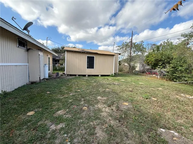 a backyard of a house with lots of green space