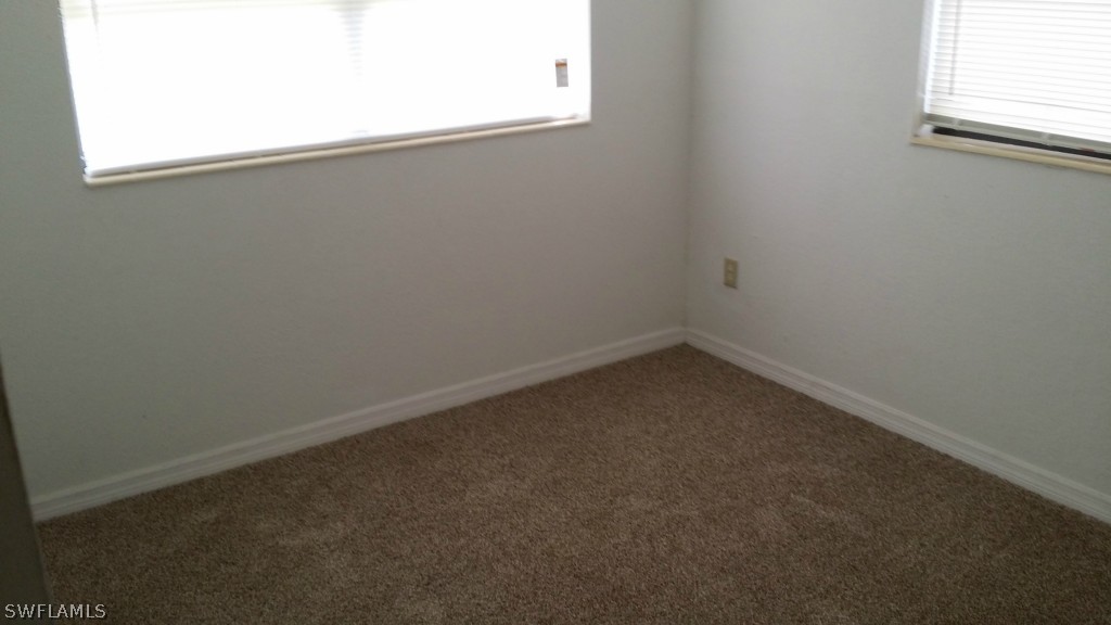 102 Jasmine Road West Lehigh Acres, FL 33936 - Photo 11 of 12 an empty room with a window