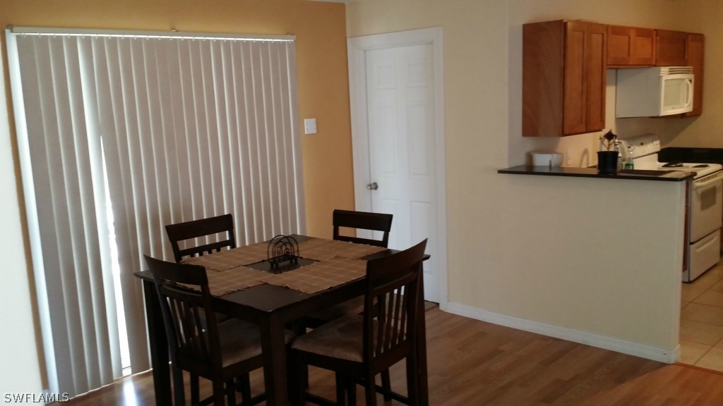 102 Jasmine Road West Lehigh Acres, FL 33936 - Photo 3 of 12 a view of a workspace with furniture