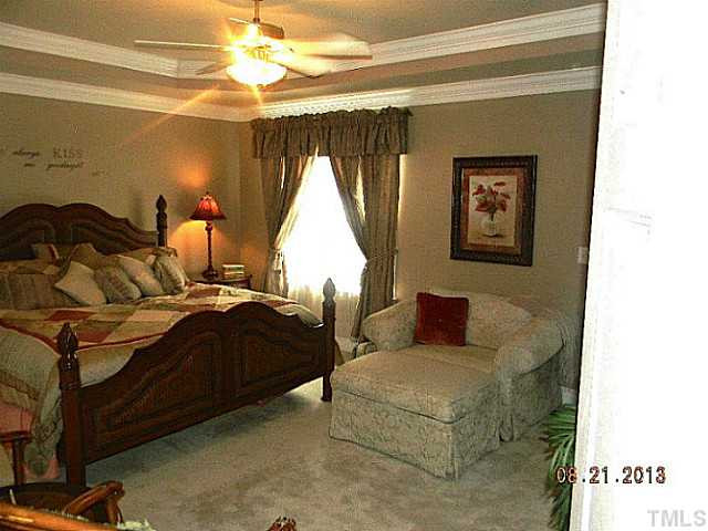 5205 Deergrass Court Raleigh, NC 27613 - Photo 13 of 25 First Floor Master! This one has trey ceiling, crown moldings, a door to the Sunroom and room for reading. Master Suite