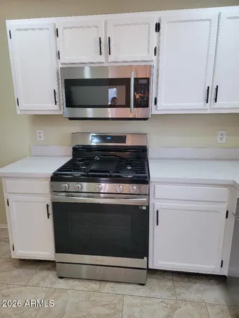 a view of room with a ceiling fan and window