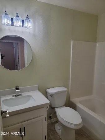 a bathroom with a shower and a bath tub