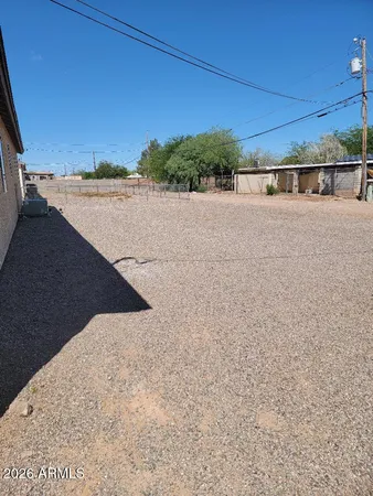 a front view of a house with parking area