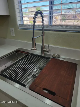 a stove top oven sitting inside of a kitchen