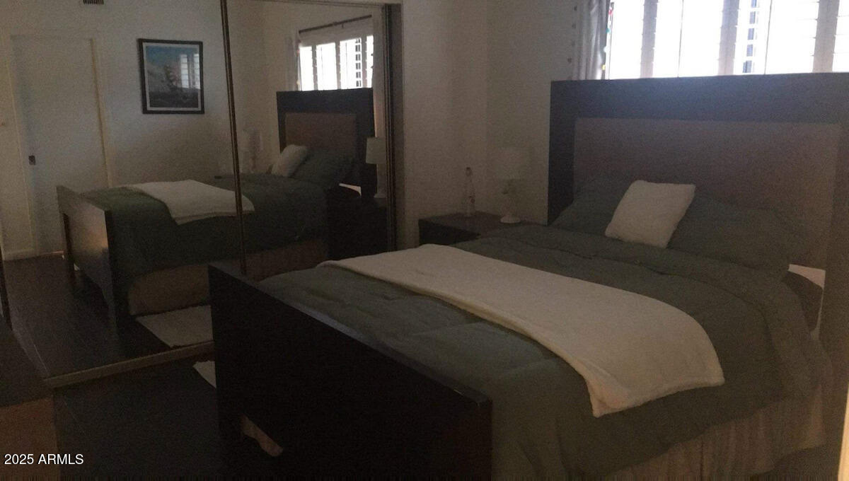 10413 North 45th Place Phoenix, AZ 85028 - Photo 11 of 25 a bedroom with a bed and a window