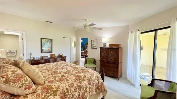 a bed room with a bed and a large mirror