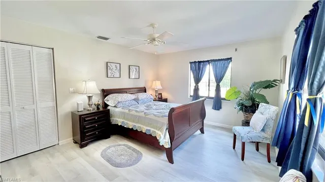 a bedroom with a bed window and a couch