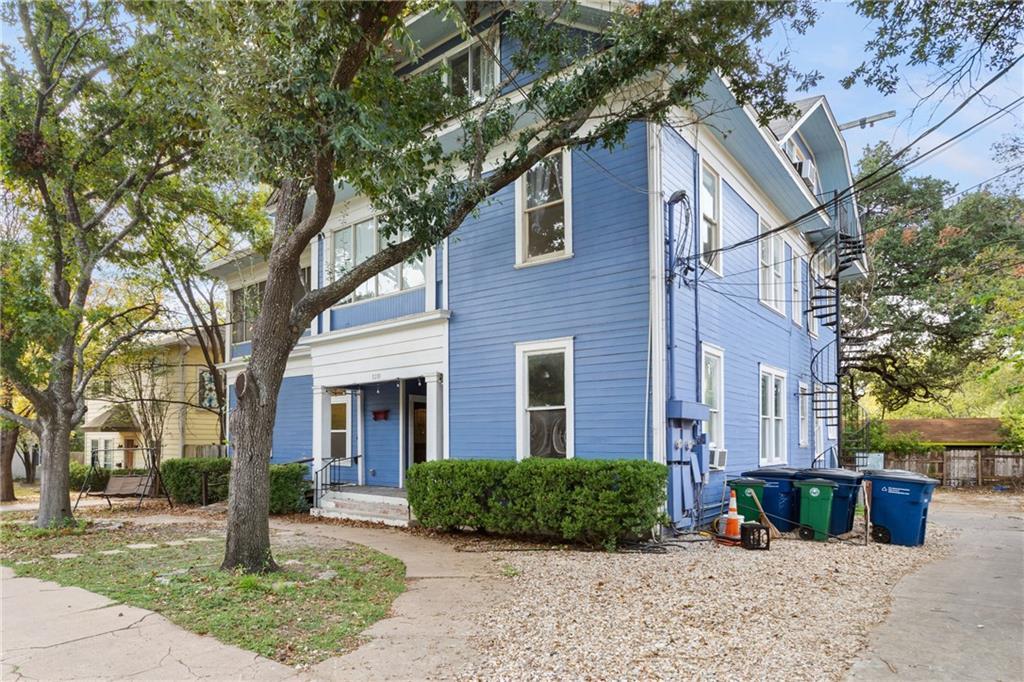 3210 Hampton Road, Unit A Austin, TX 78705 - Photo 19 of 25 A classic multi-story exterior features horizontal wood siding and an inviting covered entry porch.