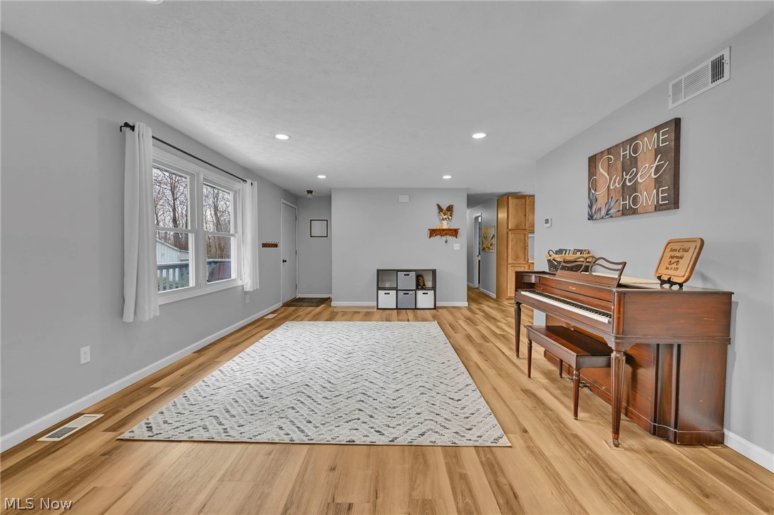 259 East Ohio Avenue Rittman, OH 44270 - Photo 14 of 41 Living area with light wood-style floors and recessed lighting