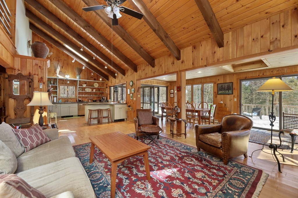 49 Judd Road Otis, MA 01253 - Photo 4 of 42 a living room with furniture and a floor to ceiling window