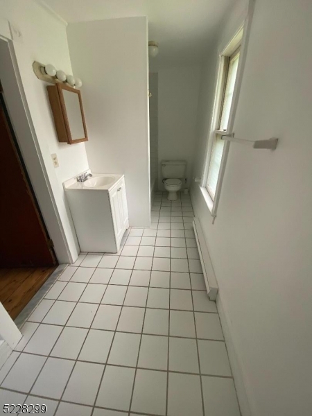 9 Dock Road Denville, NJ 07866 - Photo 17 of 21 a view of an empty room and a bathroom