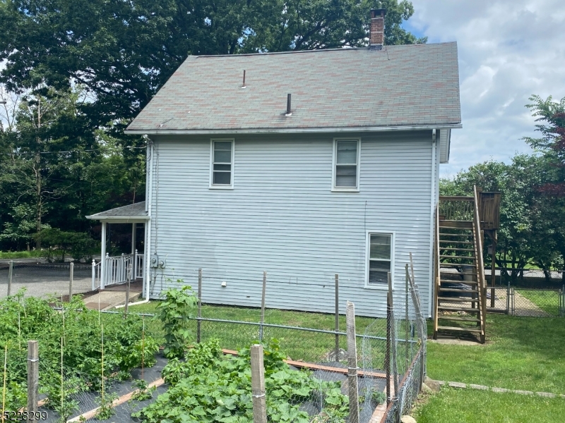 9 Dock Road Denville, NJ 07866 - Photo 20 of 21 a view of house with backyard space and garden