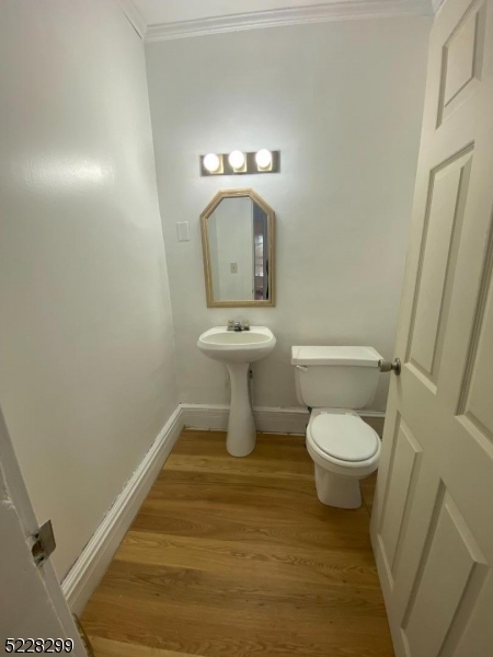 9 Dock Road Denville, NJ 07866 - Photo 4 of 21 a bathroom with a toilet and a sink