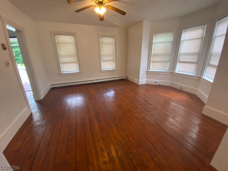9 Dock Road Denville, NJ 07866 - Photo 5 of 21 wooden floor in an empty room with a window