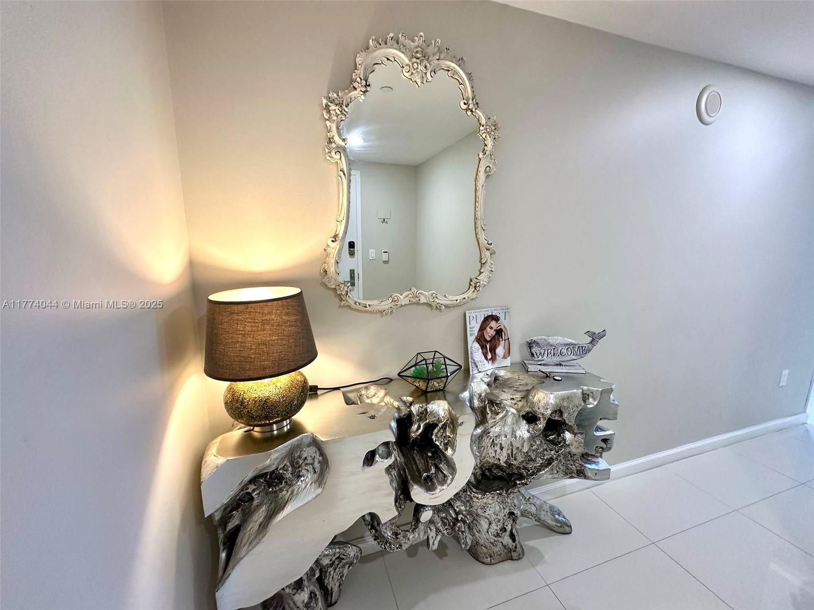 485 Brickell Avenue, Unit 4408 Miami, FL 33131 - Photo 5 of 15 a bathroom with a sink mirror and toilet