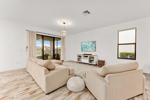 a living room with furniture and a large window