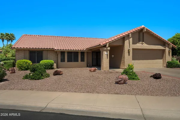 a front view of a house with garage