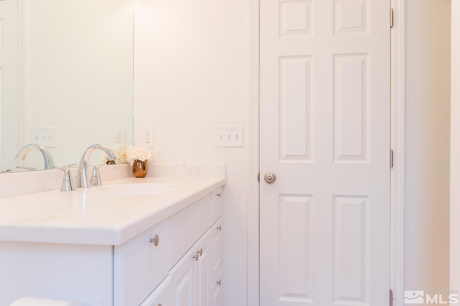 430 Burns Street Reno, NV 89502 - Photo 4 of 12 a bathroom with a sink and a mirror