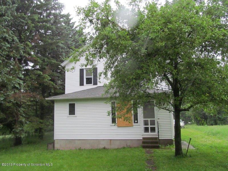 2140 Madisonville Road Moscow, PA 18444 - Photo 22 of 23 a view of a house with a yard