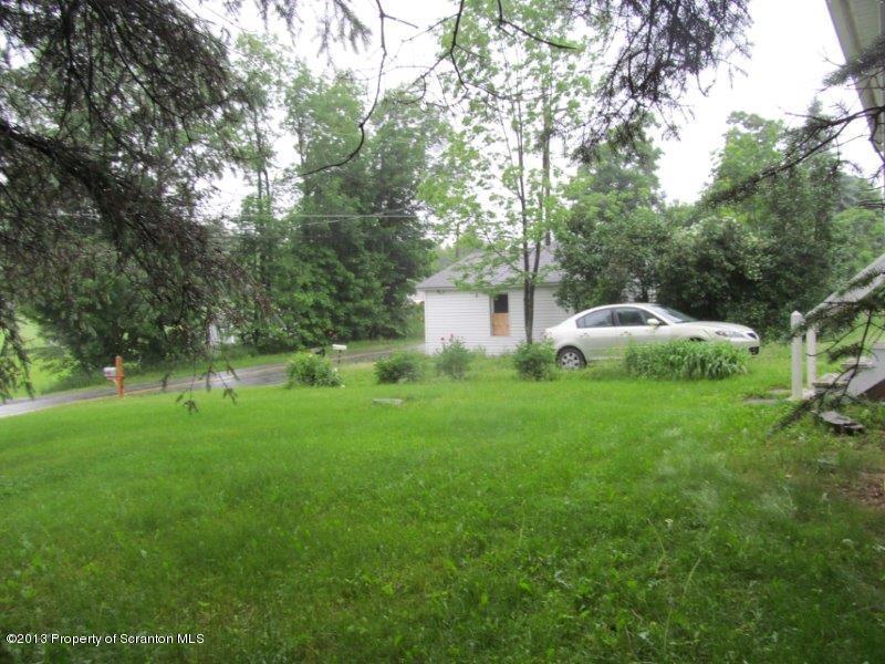 2140 Madisonville Road Moscow, PA 18444 - Photo 6 of 23 a view of backyard with swimming pool and green space