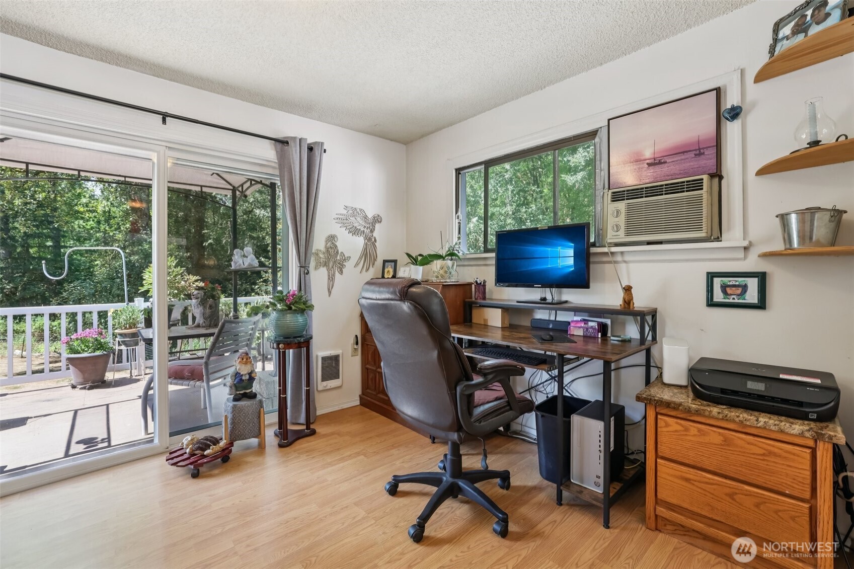 17209 West Riverside Drive Bothell, WA 98011 - Photo 15 of 39 a view of a workspace with furniture and a window