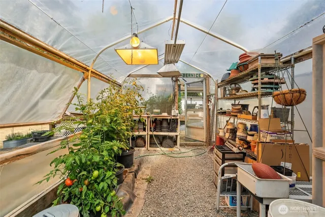 a view of a chairs and table in the patio