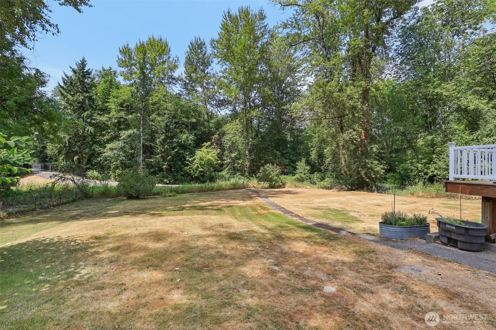 17209 West Riverside Drive Bothell, WA 98011 - Photo 32 of 39 a view of a backyard with trees